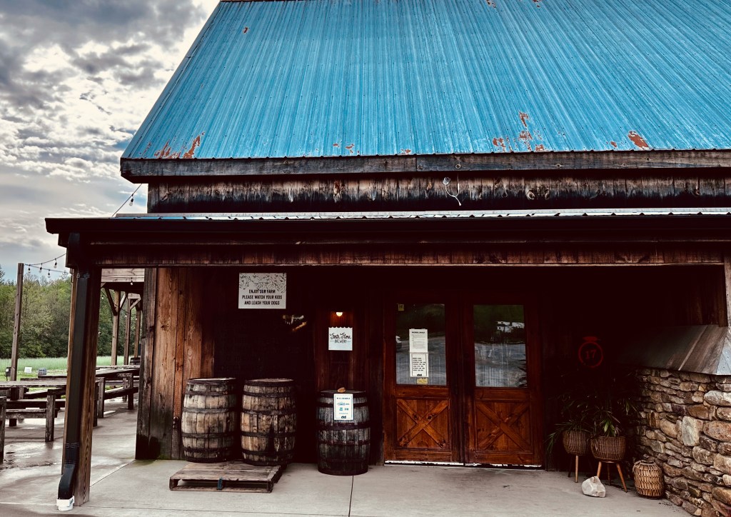 Fonta Flora farmhouse brewery front porch, on a stormy day in the North Carolina countryside